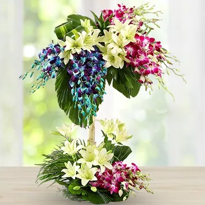 Orchids & Lilies one of the most magnificent two level arrangement